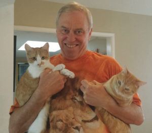 Dr. Keith Nolop with his cats, that are now in need of a home.
