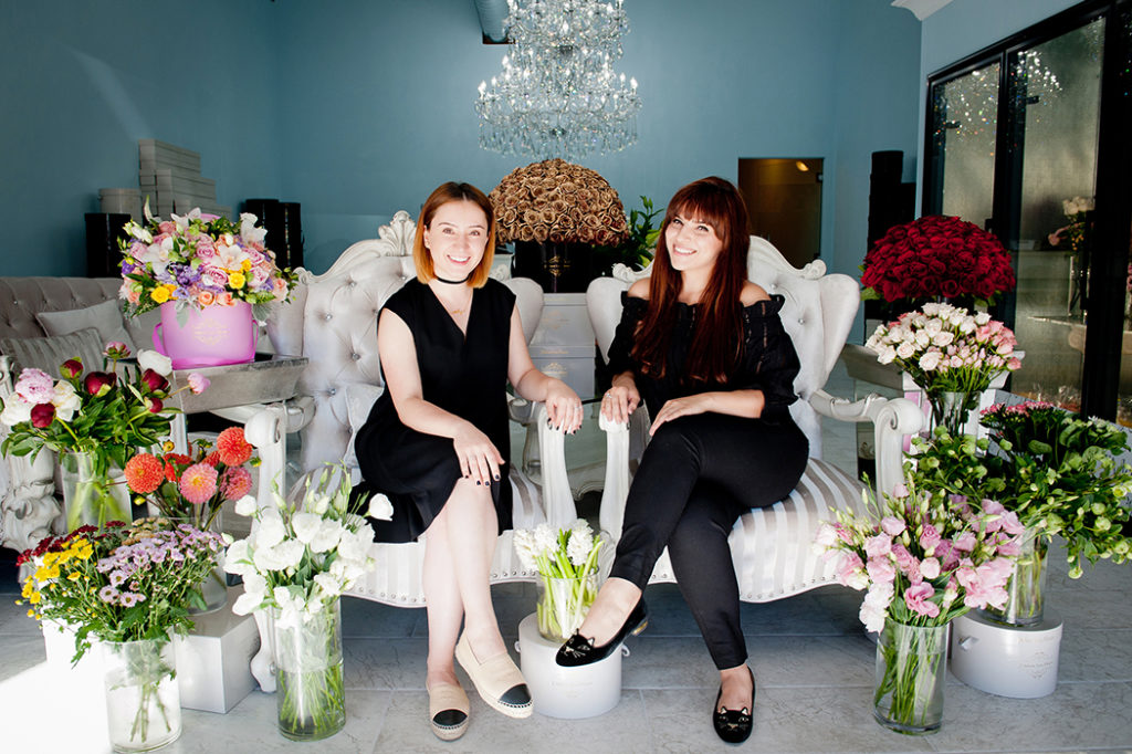Eliza Glants (left) and Alisa Tovmanyan will design the perfect flower arrangement in one of their signature hat boxes. Photo: Lesly Hall